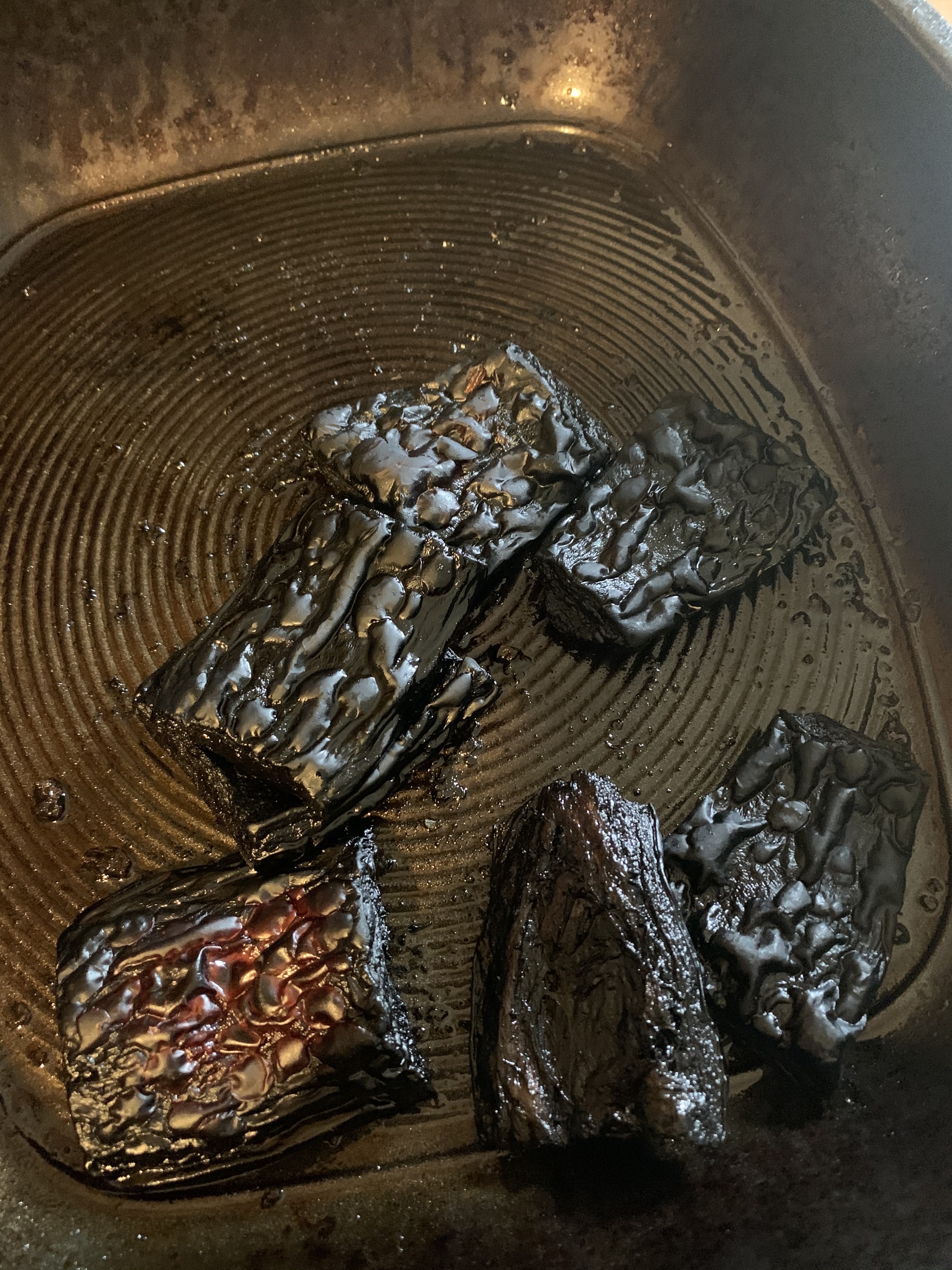 Very burnt butternut squash in a pan